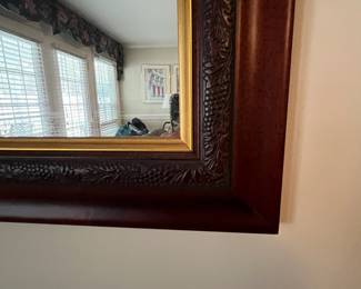 C46 - $60. Wooden Framed Wall Mirror. Measures 37.25" wide x 29" tall. 