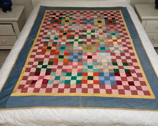 C147 - $50. Patchwork Quilt. Measures 49" x 66". Has some fading and discolored / stained spots. 