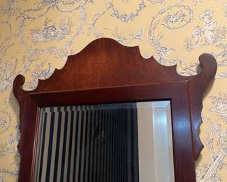 C122 - $150. Antique Chippendale Mirror. Mirror has been replaced and features a beveled edge replacement. Measures 22" wide x 35.75" tall. 