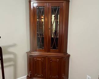 C95 - $225. Solid Wood Corner Cabinet - Moves in 2 Pieces. Measures 24" out from each corner and  39" across the front. 76" tall. Moves in 2 Pieces. 