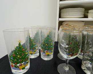 C137 - $150. Large Lot of Christmas Dishes. Glasses show the most wear on the gold trim. 