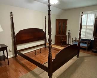 C4 - $250. King Sized 4 Poster Bed. No name. Some wear along the footboard. Measures 81.5" wide x 89" long x 80" tall. 