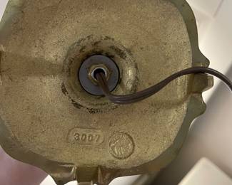 C149 - $30. Harvin Vintage Brass Lamp. Measures 24" tall. Shade has a small tear inside. 