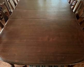C13 - $350. Antique Mahogany Dining Table. Measures 59" long with NO leaf. 48" wide x 30" tall. (Has 3 Leaves - each adds 12" )  1 arm chair + 6 regular chairs. Was refinished in 2011. Solid table but it is an antique and has some issues from general use. Some wiggles and some veneer issues. 