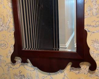 C122 - $150. Antique Chippendale Mirror. Mirror has been replaced and features a beveled edge replacement. Measures 22" wide x 35.75" tall. 