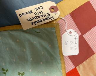 C147 - $50. Patchwork Quilt. Measures 49" x 66". Has some fading and discolored / stained spots. 