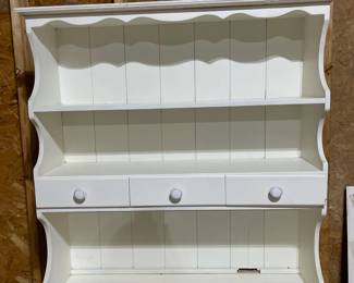 C84 - $40. Vintage White Hutch. Moves in 2 pieces for easier transport. Castors attached. Top is 36" wide x 9.5" deep x 38" tall. Base is 37" wide x 15" deep x 33" tall. 