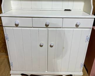 C84 - $40. Vintage White Hutch. Moves in 2 pieces for easier transport. Castors attached. Top is 36" wide x 9.5" deep x 38" tall. Base is 37" wide x 15" deep x 33" tall. 