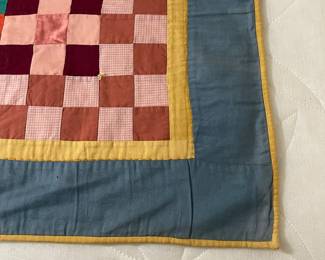 C147 - $50. Patchwork Quilt. Measures 49" x 66". Has some fading and discolored / stained spots. 