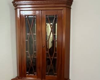 C95 - $225. Solid Wood Corner Cabinet - Moves in 2 Pieces. Measures 24" out from each corner and  39" across the front. 76" tall. Moves in 2 Pieces. 
