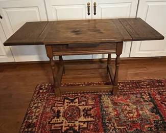 C48 - $40. Antique Side Table. Measures 24" x 18" x 21.5" tall. 40" when leaves are extended out. 