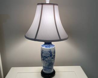 C153 - $30. Blue & White Lamp on Wooden Base. Measures 24" tall. Shade is in good condition!