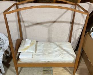 C110 - $60. Childs Toy Canopy Bed. Missing finials but could easily be replaced. Custom Handmade Bedding included. Measures 38.5" x 21.5" x 46" tall. 