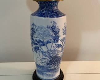 C153 - $30. Blue & White Lamp on Wooden Base. Measures 24" tall. Shade is in good condition!