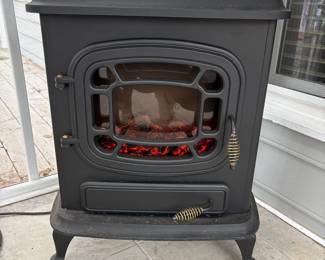 C73 - $50. Electric Fireplace. Measures 23" wide x 14" deep x 28.25" tall. 