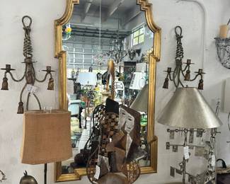 Giltwood Italian scrolling mirror, Pair of iron rope-and-tassel sconces, Mid-century bronze horse lamp, and more