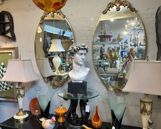Pair of vintage oval mid-century mirrors, Pair of Stiffel swag lamps, Bust of David, and more.