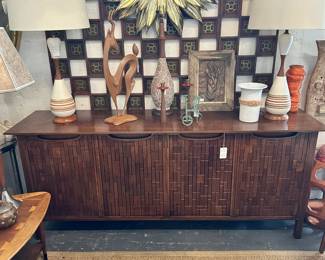 Vintage John Stuart credenza, Pair of mid-century teakwood and pottery table lamps, Gilt metal convex mirror, and more
