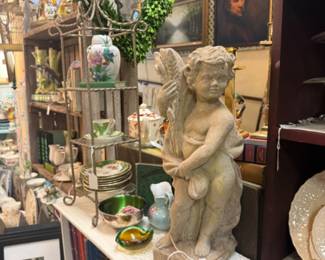 large statuary, collectible plates, greenery, tea cups and saucers