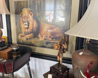 framed lion artwork, lamps, side table, statuary