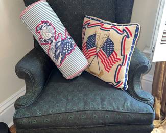 Upholstered wingback chair with American themed pillows