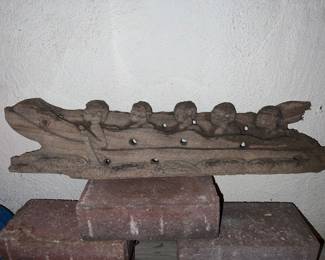 Folk art wood canoe carving with five figures