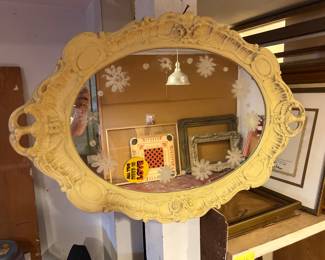 Vintage-style yellow ornate wall mirror