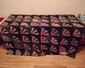 Many holes in antique quilt