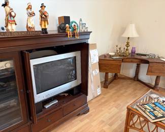 TV cabinet with the antique desk in the background on the right