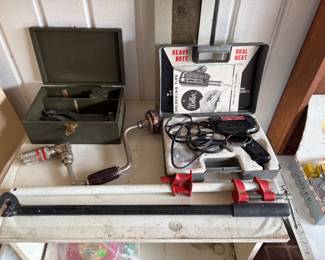Soldering gun, antique drill, clamp