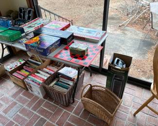 Boxes of cookbooks, table, full of games