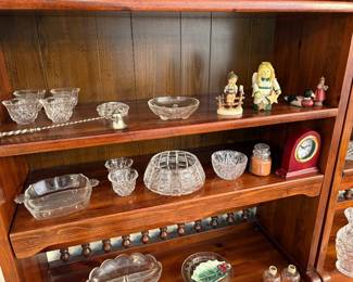 leaded glass pieces and Hummel figurine