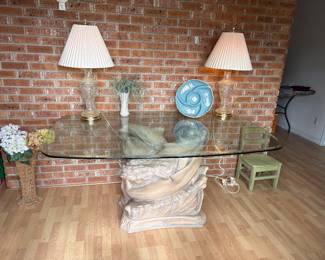 Large glass top dinning table with dolphin pedestal 