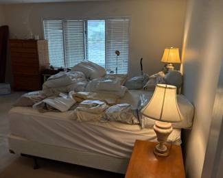 Bedroom full of sheets and bedspreads