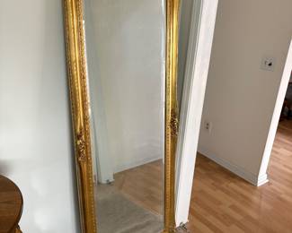 Gold trimmed floor mirror