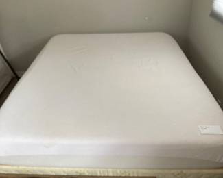 queen bed and framed art