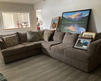 L-shaped sofa and framed art