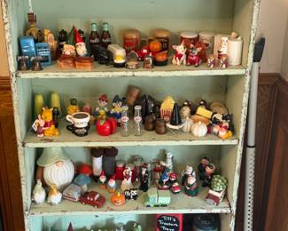 This unique collection of salt and pepper shakers is a must-see! The seagreen distressed shelf is also for sale. 