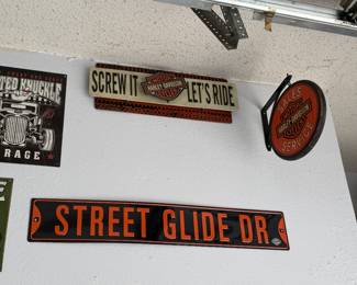 Harley Davidson "Street Glide Dr" pressed metal sign; Harley Davidson "Sales and Service" sign; Harley Davidson "Screw it let's ride" sign; 