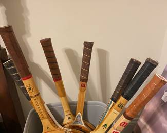 Tennis rackets, some are signed. 