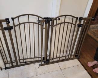 Two metal dog gates 