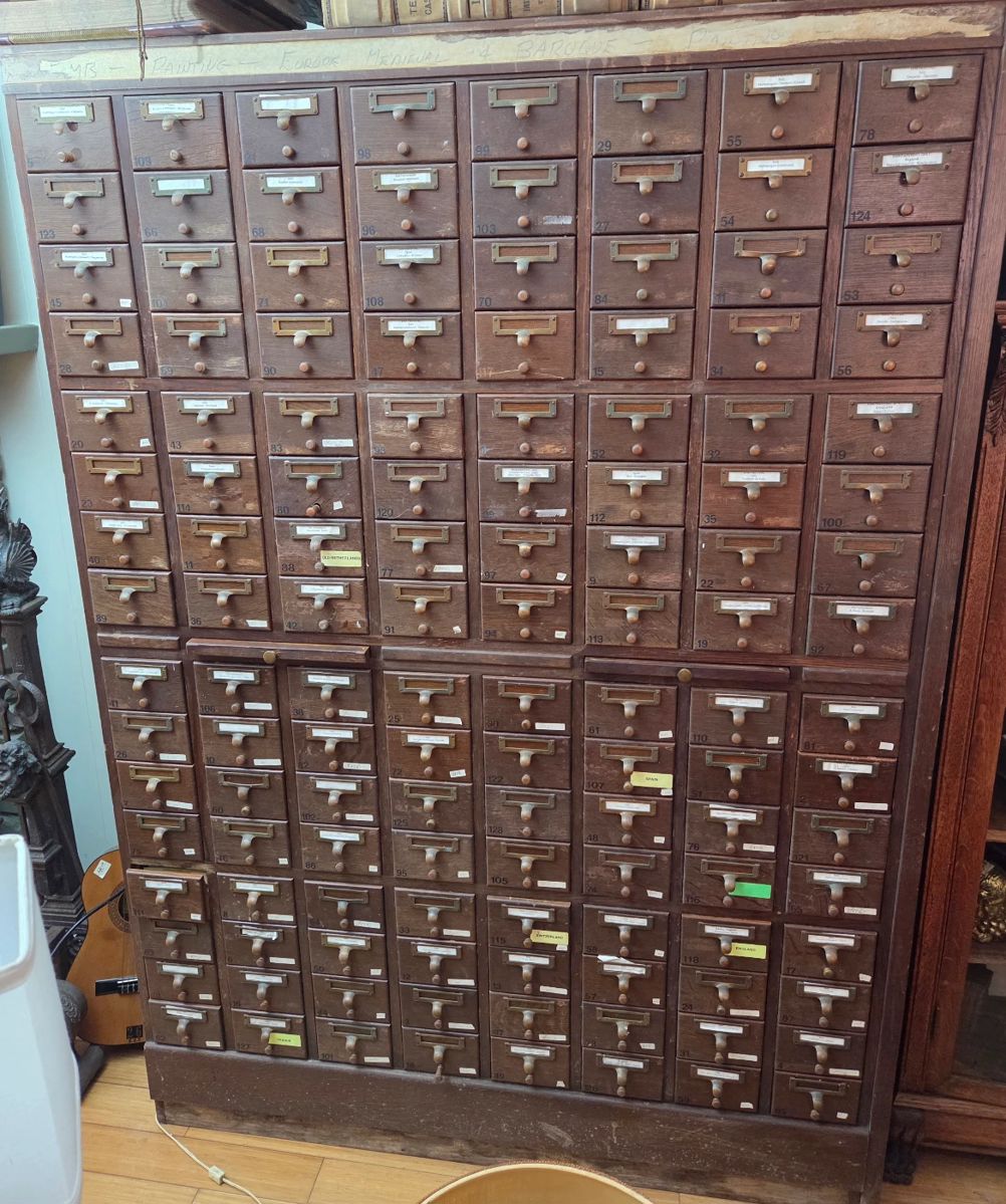 An amazing collection within a card catalog file cabinet. Being sold as a collection with the glass slides.