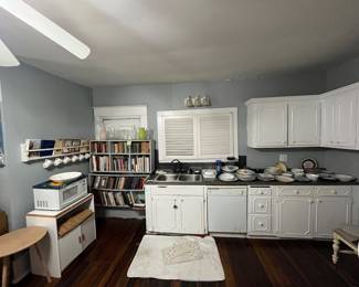 Cook books, microwave and shelf, dishes, vases,