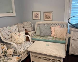 White wicker bench with cushion, wicker rocker, wicker storage chest, baskets, decorative pillows and more