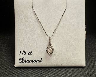 14 karat gold 1/8 carat diamond solitaire pendant with chain