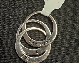 .925 3 interlocked ring necklace pendant that says Partners 4 Life.