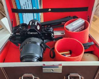 Camera with multiple lenses and Flash attachments in a vintage case