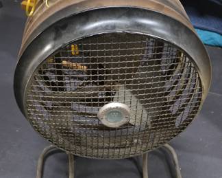 A vintage industrial floor fan in excellent condition.