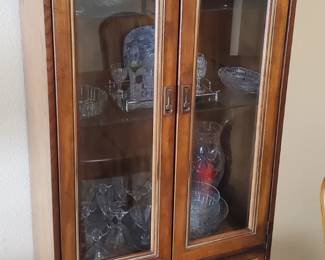 Lighted hutch with silverware drawer.