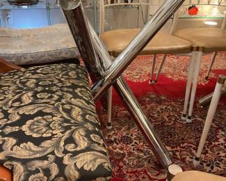 Glass top rectangular dining table with abstract chrome legs (30” x 71” x 39”) $625 + tax
